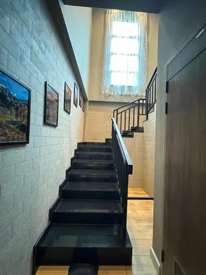 a stair case in a building with stairs and a window at Villa Maria Luxury in Kamala Beach