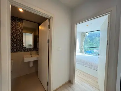 a bathroom with a sink and a mirror at The Base Height Phuket in Phuket Town
