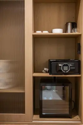 a toaster oven and a microwave in a kitchen at Laya Resort - Forest View Studio in Layan Beach