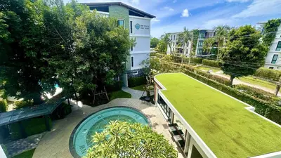 an overhead view of a backyard with a pool and grass at Title V - 1 br Bamboo Rawai Apartment in Karon Beach