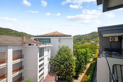 a view from the balcony of a building at Wyndham 1221 Naiton Beach Studio Forrest View in Phuket Town