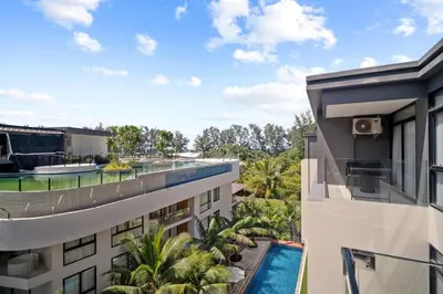 an aerial view of a building with a swimming pool at Wyndham 1221 Naiton Beach Studio Forrest View in Phuket Town