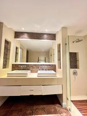 a bathroom with two sinks and a large mirror at Spacious 3 bedroom, 100m walk to Layan Beach in Phuket
