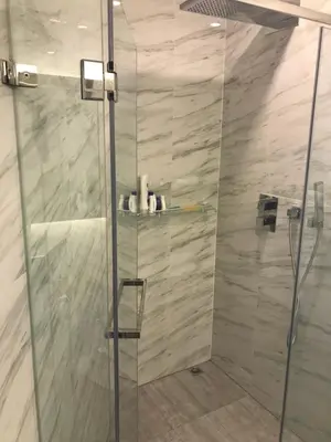 a shower with a glass door in a bathroom at OCEANA Kamala SeaviewCondo B41 in Kamala Beach