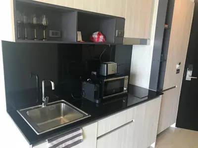 a kitchen counter with a sink and a microwave at OCEANA Kamala SeaviewCondo B41 in Kamala Beach