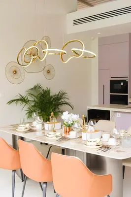 a kitchen with a table with chairs and a chandelier at Phuket luxury Asherah villa Bang Tao in Ban Phru Champa