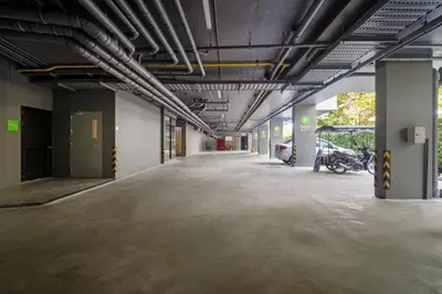 an empty parking lot in a parking garage at Wyndham Garden 1220 Modern Studio Next to Naithon in Phuket Town