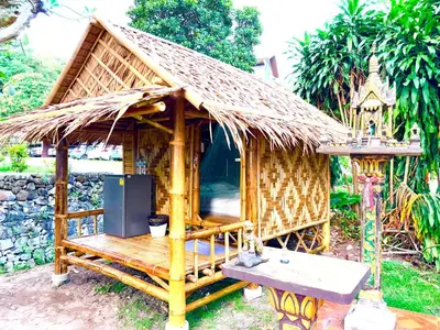 a small hut with a thatched roof at Patong Canal House 2 in Patong Beach