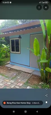 a small blue house with a plant in front of it at Bang Riss Kee Home Stay3 in Ko Yao Noi