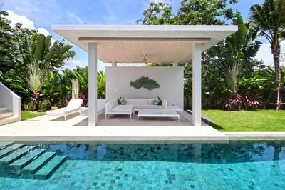 a gazebo next to a swimming pool at Botanica Luxury Pool Villa Phuket in Thalang