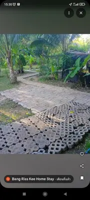 a screenshot of a brick road with a picture of a house at Bang risskee home stay2 in Ko Yao Noi