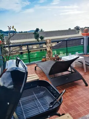 a patio with a grill on a roof at Kata Lina rooftop in Kata Beach
