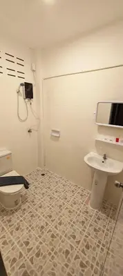 a bathroom with a toilet and a sink at Tiger Nanai guest house in Patong Beach