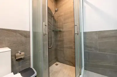 a shower with a glass door in a bathroom at Charming 1-Bed Apt (T3- 629) in Phuket Town