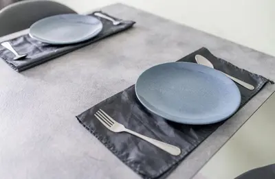a table with a plate and a fork and knife at Charming 1-Bed Apt (T3- 629) in Phuket Town