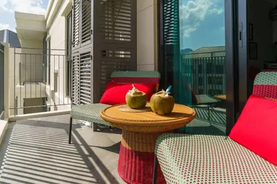 two green apples on a table on a balcony at The Title Legendary Vintage Gloss in Bang Tao Beach