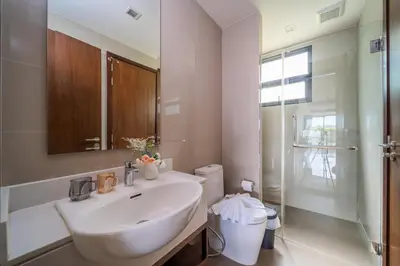 a white bathroom with a sink and a toilet at Laguna park 5bedroom private pool villa in Laguna Phuket