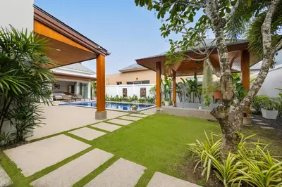 an image of a backyard with a swimming pool and a house at Villa Hemi 2BR Modern Thai Style with Private Pool in Rawai Beach