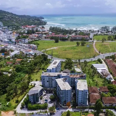 an aerial view of a city with buildings and the ocean at C252 Great Facility Condo Near Beach & Rooftop Pool in Kamala Beach