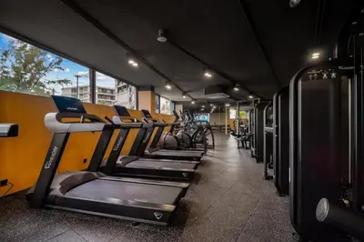 a row of rows of treadmills on a bus at Kora Resort A110 – Luxury Beachfront Studio in Phuket Town
