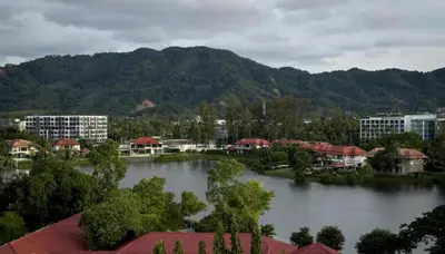 a view of a city with a river and buildings at Skypark Laguna Apartment with Rooftop Pool at Bang Tao Phuket in Laguna Phuket
