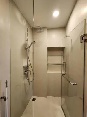 a shower with a glass door in a bathroom at Skypark Laguna Apartment with Rooftop Pool at Bang Tao Phuket in Laguna Phuket