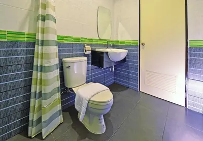 a bathroom with a toilet and a sink at Kiss Hometel in Ao Nang Beach