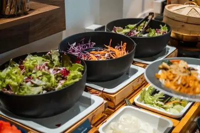a buffet with four bowls of salads and dips at Two Bedroom Sea View by Triple 8 Asia in Layan Beach