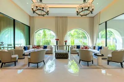 a lobby with couches and chairs and windows at Bangtao The Title Legendary by Phuket Sabay Rent F601 in Bang Tao Beach