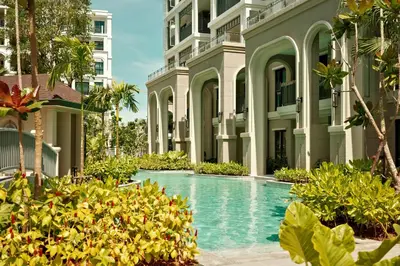 a swimming pool in front of a building at Bangtao The Title Legendary by Phuket Sabay Rent F201 in Bang Tao Beach