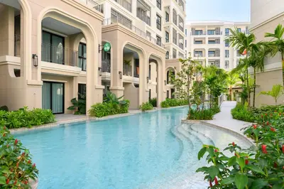 a swimming pool in the middle of a building at Bangtao The Title Legendary by Phuket Sabay Rent A212 in Bang Tao Beach