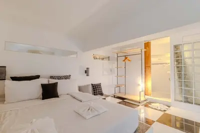 a white bedroom with a large bed and a window at V89 6BR Timeless Design Huge Pool & Mountain View in Rawai Beach