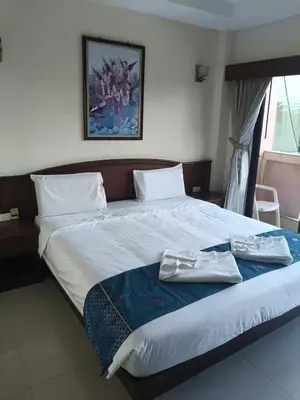 a bedroom with a large bed with towels on it at Hua LaiDe patong \u4e00\u5367\u5ba4\u5927\u5e8a\u623f in Patong Beach