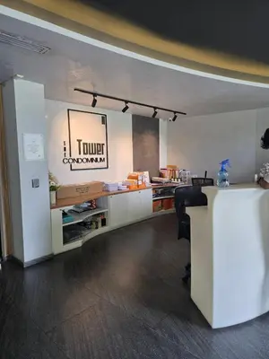 an office with a desk and a chair in a room at Tower2 Condominium in Ban Klang