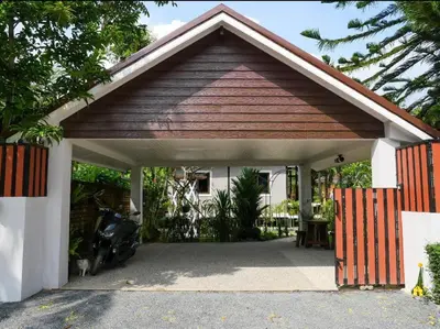 a garage with a car parked inside of it at Baan Ati Villas in Ban Han Pa To