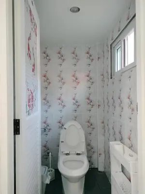 a bathroom with a toilet and a sink at Soi Saliga in Rawai Beach