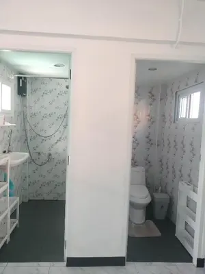 a bathroom with a toilet and a sink at Soi Saliga in Rawai Beach