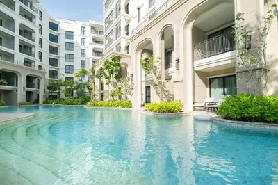 a swimming pool in the middle of a building at The Title Legendary D-605 1 BR Bangtao Beach in Bang Tao Beach