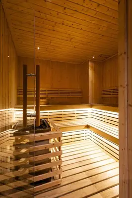 an empty sauna with wooden walls and wooden floors at The SPACE Apartment 612 in Ban Thalat Choeng Thale