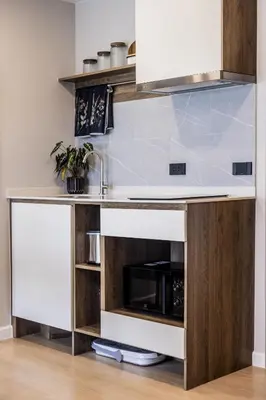 a kitchen with a counter and a sink at The SPACE Apartment 612 in Ban Thalat Choeng Thale