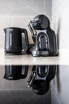 a shelf with two coffee cups on it at The SPACE Apartment 614 in Ban Thalat Choeng Thale