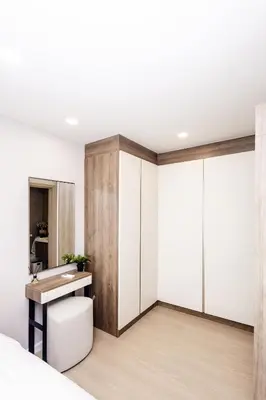 a bedroom with a desk and a sink in a room at The SPACE Apartment 614 in Ban Thalat Choeng Thale
