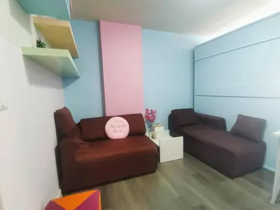 a living room with a couch and a chair at Valley Mountain ViewCity Proximity Golden Eight Apartment in Phuket Town