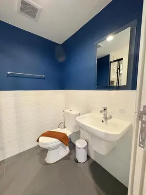 a bathroom with a toilet and a sink at 1 Bedroom close to Central Shopping Mall in Ban Rangeng