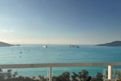 a view of the ocean with boats in the water at Highest Apartment in Phuket Panaromic Seaview in Patong Beach