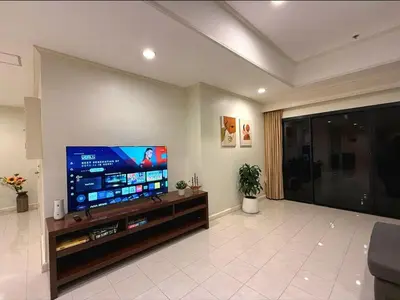 a living room with a large flat screen tv at Highest Apartment in Phuket Panaromic Seaview in Patong Beach