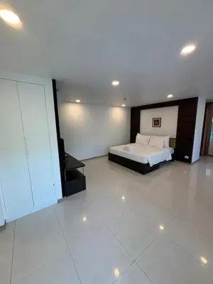 a bedroom with a bed and a television in it at 3 Beds patong baycleef residence in Patong Beach