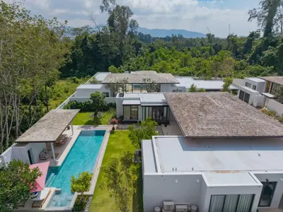 an aerial view of a house with a swimming pool at Luxury 4BR Pool Villa in Botanica - Villa Boa in Ban Phru Champa