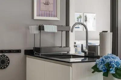 a kitchen counter with a sink and a faucet at The Title Legendary White Reef 2BR in Bang Tao Beach