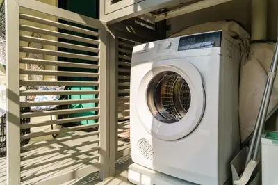 a washer and dryer in a laundry room at The Title Legendary White Reef 2BR in Bang Tao Beach